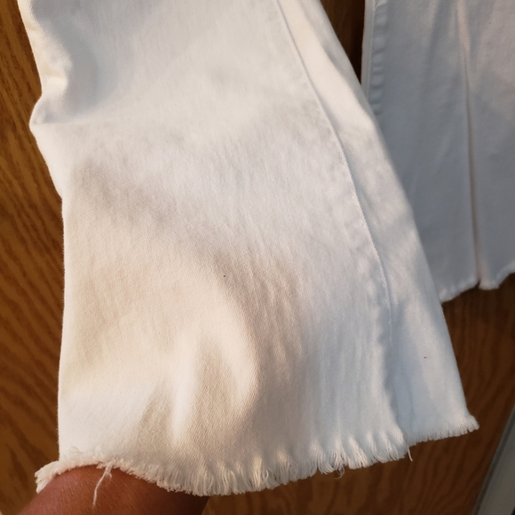 Cute white jeans, ripped at knees with flare bottoms. Great condition. - Picture 8 of 8